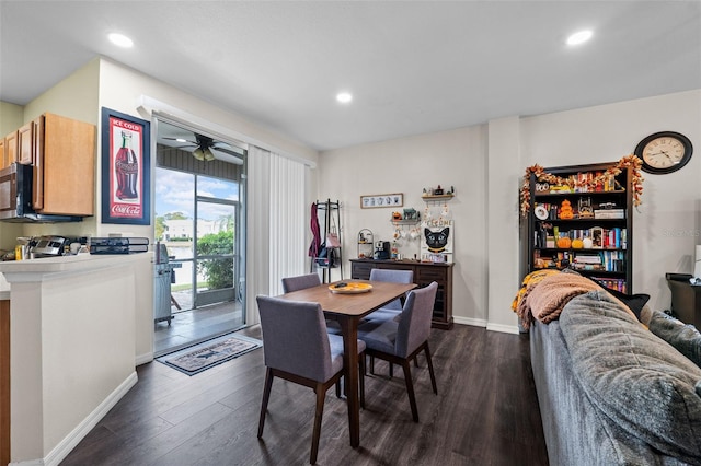 dining area with ceiling fan and dark wood-type flooring