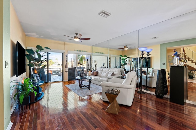 living room featuring ceiling fan and wood-type flooring