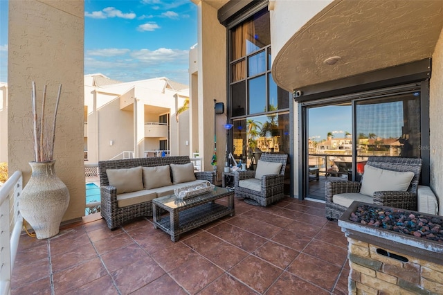 view of patio / terrace featuring outdoor lounge area and a balcony