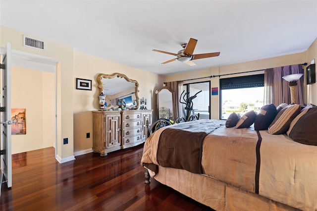 bedroom with ceiling fan, access to exterior, and dark wood-type flooring