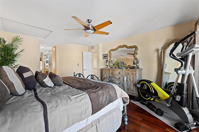 bedroom with dark hardwood / wood-style floors and ceiling fan