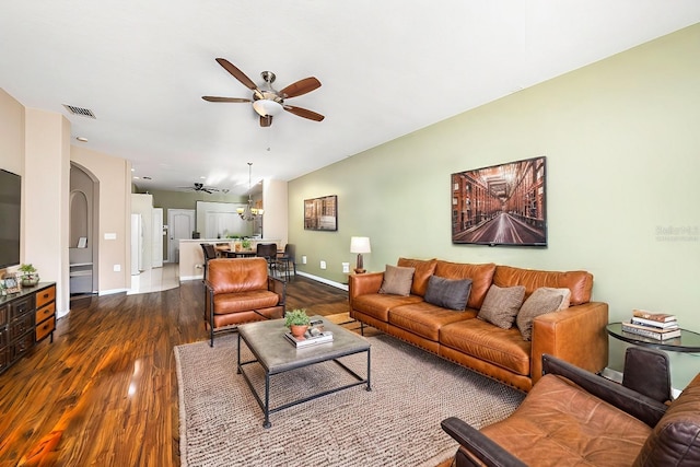 living room featuring lofted ceiling, wood-type flooring, and ceiling fan