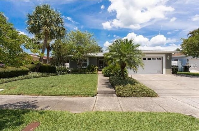 single story home with a garage and a front yard