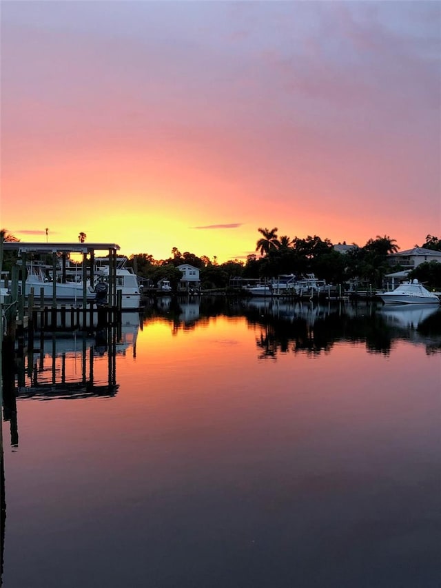 view of dock with a water view and boat lift