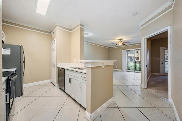 4323 Bayside Village Dr Unit 105, Tampa, FL 33615 - kitchen featuring a sink, stainless steel dishwasher, black electric range, ceiling fan, and a peninsula