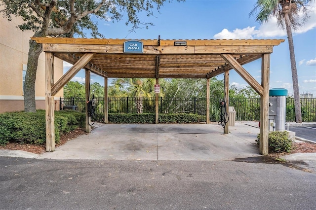 4323 Bayside Village Dr Unit 105, Tampa, FL 33615 - view of car parking with fence