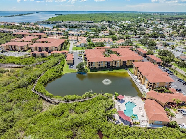 4323 Bayside Village Dr Unit 105, Tampa, FL 33615 - drone / aerial view of a nearby body of water and a pool area