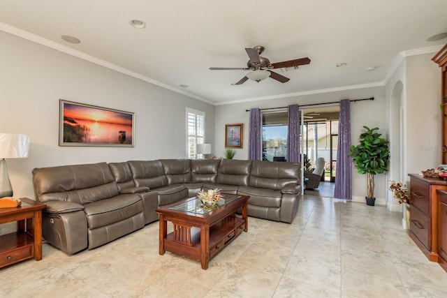 living room with ornamental molding and ceiling fan