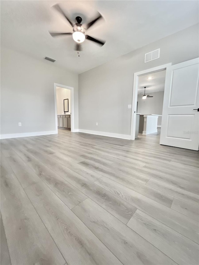 unfurnished living room with light hardwood / wood-style floors and ceiling fan