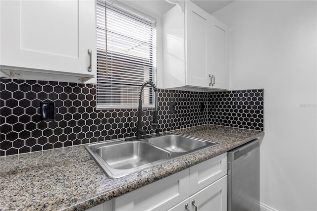 kitchen with sink, dishwasher, backsplash, stone countertops, and white cabinets