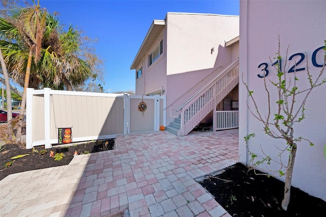 view of property exterior with a patio