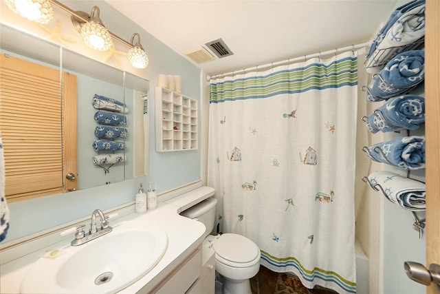 bathroom with toilet and vanity