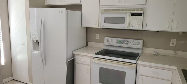 6212 Bayside Key Dr, Tampa, FL 33615 - kitchen featuring white appliances, light countertops, and white cabinetry
