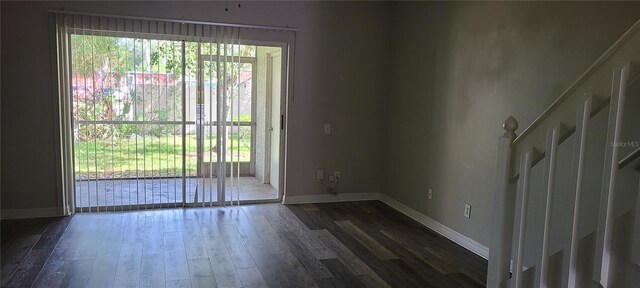 6212 Bayside Key Dr, Tampa, FL 33615 - spare room featuring dark wood-style flooring and baseboards