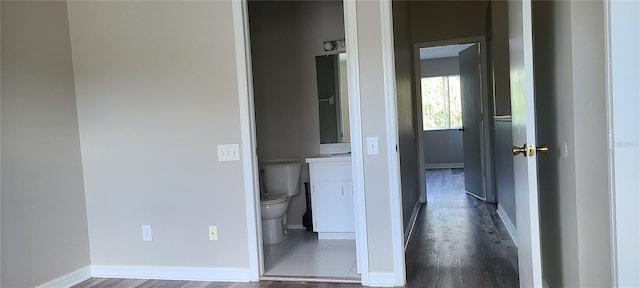 6212 Bayside Key Dr, Tampa, FL 33615 - hall with wood finished floors and baseboards