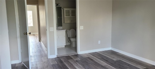 6212 Bayside Key Dr, Tampa, FL 33615 - unfurnished bedroom featuring dark wood-type flooring and baseboards