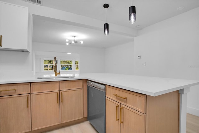 kitchen with dishwasher, decorative light fixtures, light brown cabinetry, sink, and kitchen peninsula