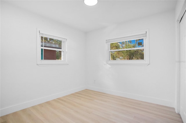 spare room with light wood-type flooring