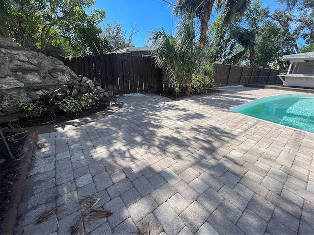 view of pool featuring a patio