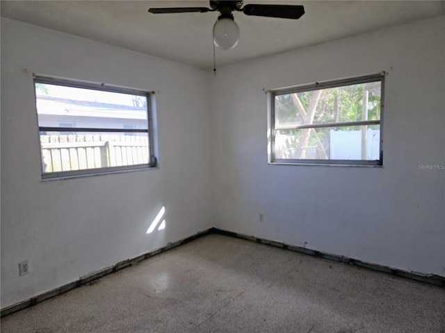 spare room with ceiling fan