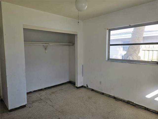 unfurnished bedroom featuring a closet