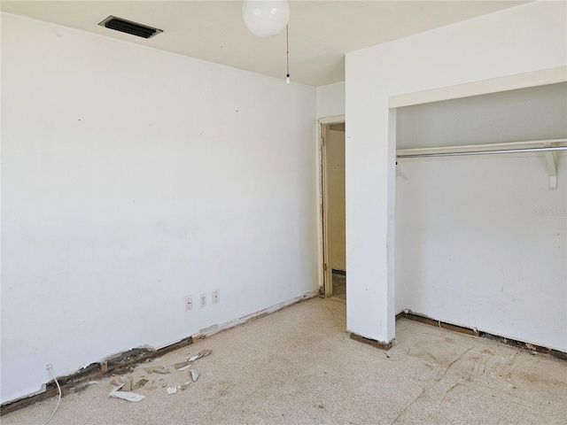 unfurnished bedroom with a closet