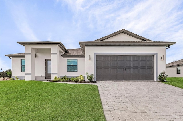 view of front of house featuring a garage and a front yard