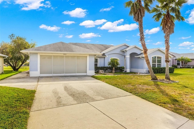 ranch-style home with a garage and a front lawn