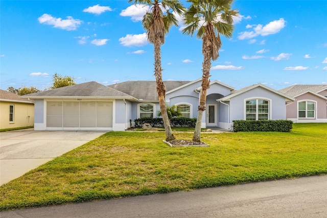 ranch-style home featuring a garage and a front yard