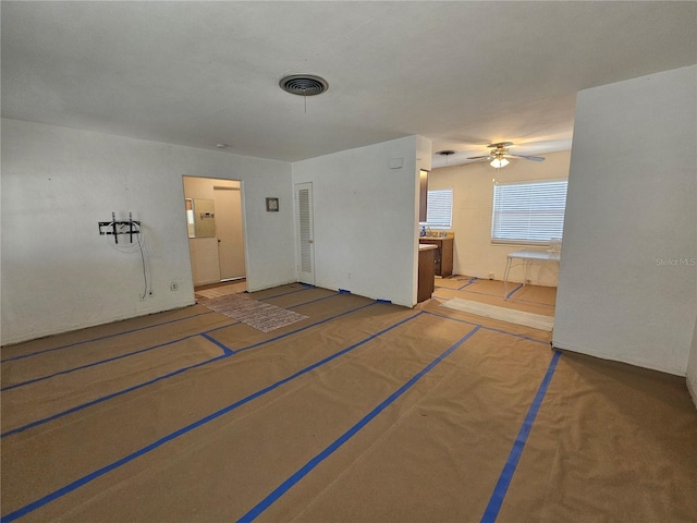 unfurnished room featuring carpet and ceiling fan