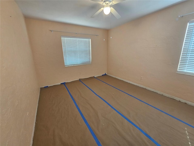 unfurnished room featuring ceiling fan