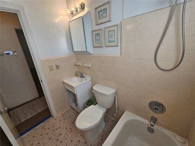 bathroom featuring vanity, toilet, tile walls, and tile patterned flooring