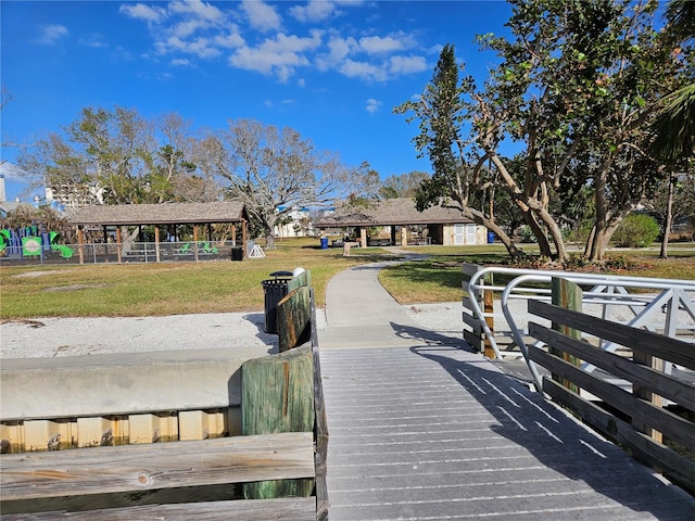 view of dock with a yard