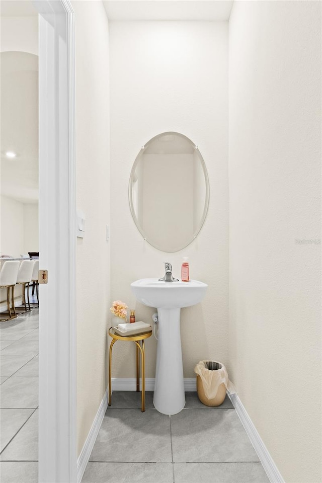 bathroom with tile patterned floors