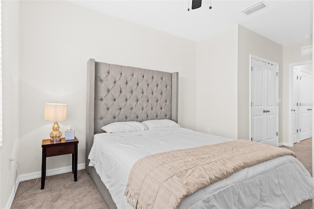 bedroom with light carpet and ceiling fan