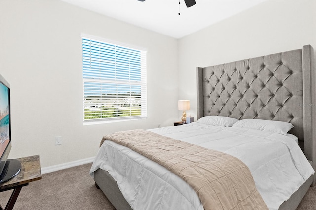 carpeted bedroom with multiple windows and ceiling fan