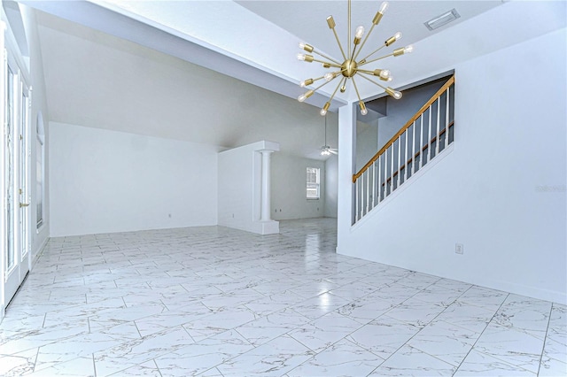 unfurnished living room with marble finish floor, visible vents, vaulted ceiling, and ceiling fan with notable chandelier