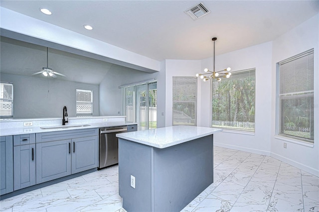 kitchen featuring visible vents, dishwasher, a center island, hanging light fixtures, and a sink