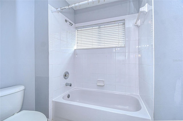 bathroom featuring toilet and shower / bathtub combination