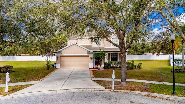 view of front property featuring a garage and a front yard