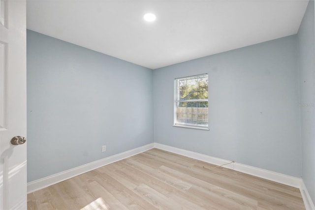 empty room with light hardwood / wood-style floors