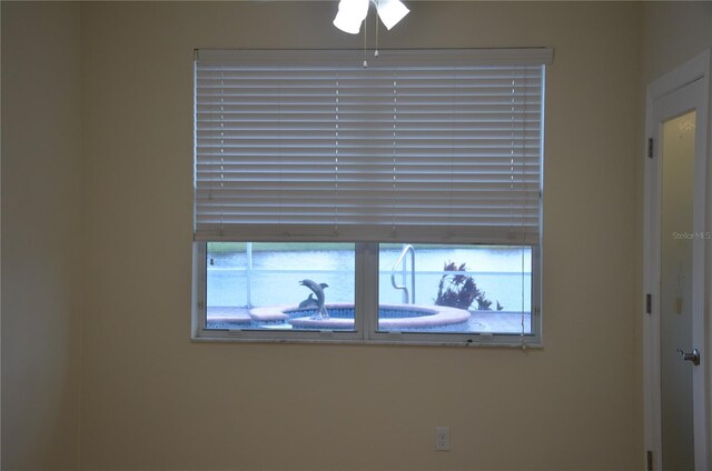 interior details featuring ceiling fan