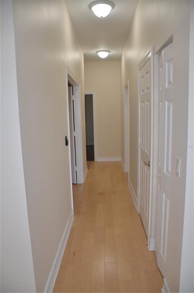 corridor featuring light wood-type flooring