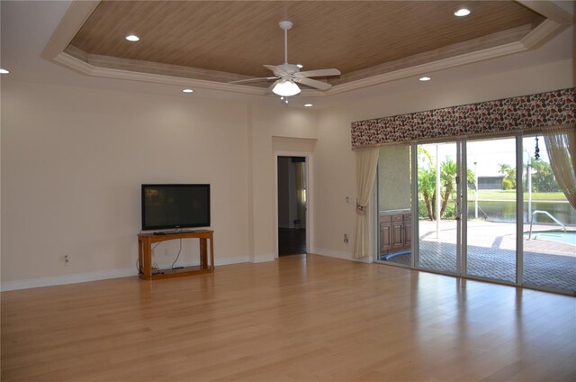 unfurnished living room featuring wooden ceiling, a raised ceiling, and light hardwood / wood-style flooring