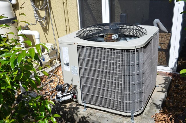 details with central air condition unit and concrete flooring