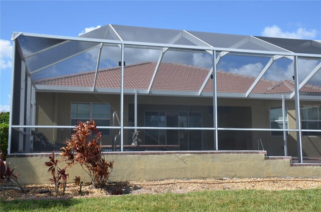 back of house featuring a lanai