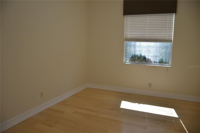 spare room featuring light hardwood / wood-style floors