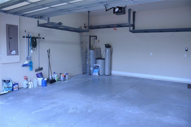 garage featuring electric panel and a garage door opener