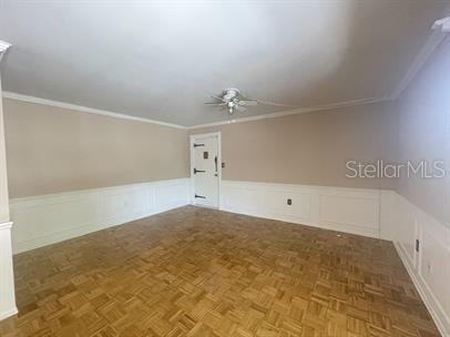 bonus room featuring ceiling fan and dark parquet floors