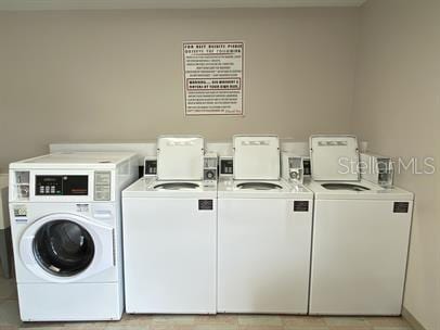 clothes washing area featuring separate washer and dryer